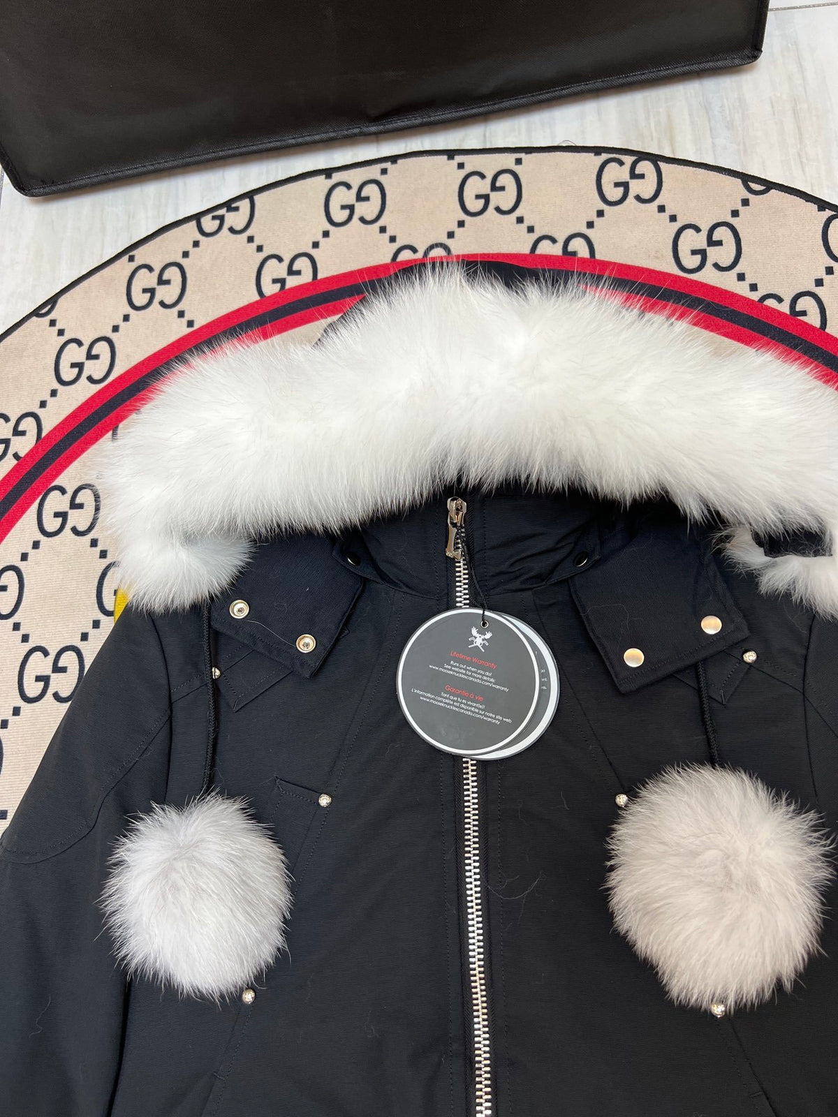 Moose Knuckles Black Cropped Hooded Bomber Jacket with Pom-Pom Details