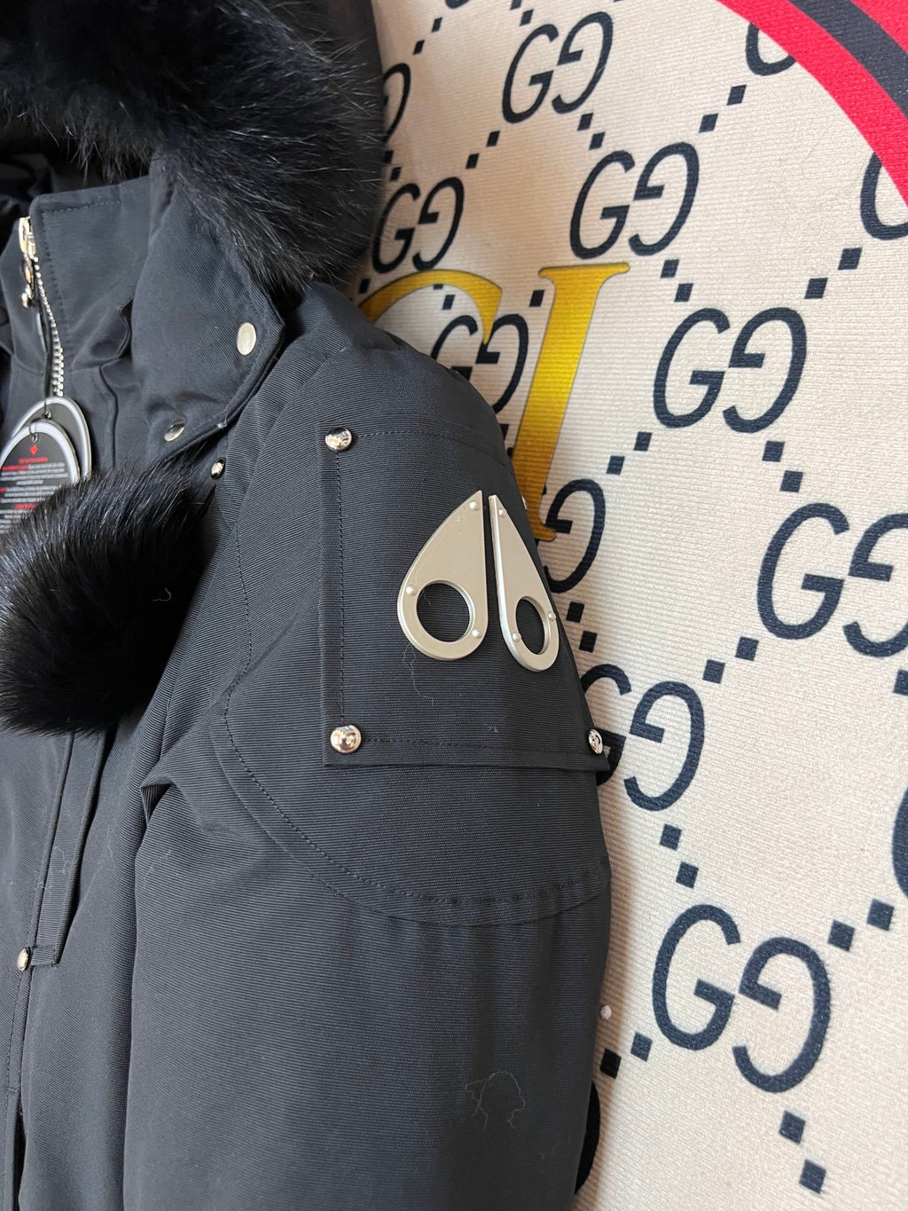 Moose Knuckles Black Cropped Hooded Bomber Jacket with Pom-Pom Details