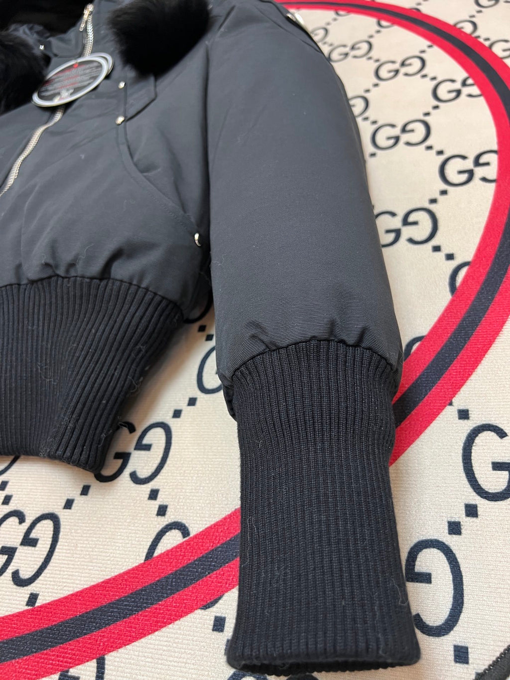 Moose Knuckles Black Cropped Hooded Bomber Jacket with Pom-Pom Details