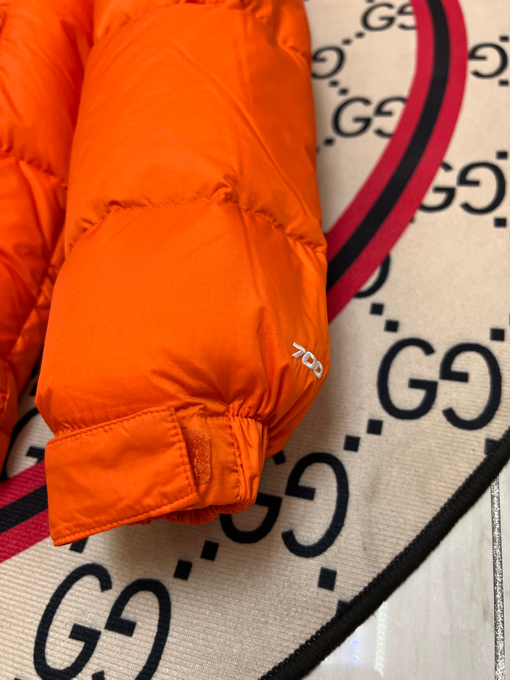 The North Face Orange and Black Colorblock Stand-Collar Puffer Jacket