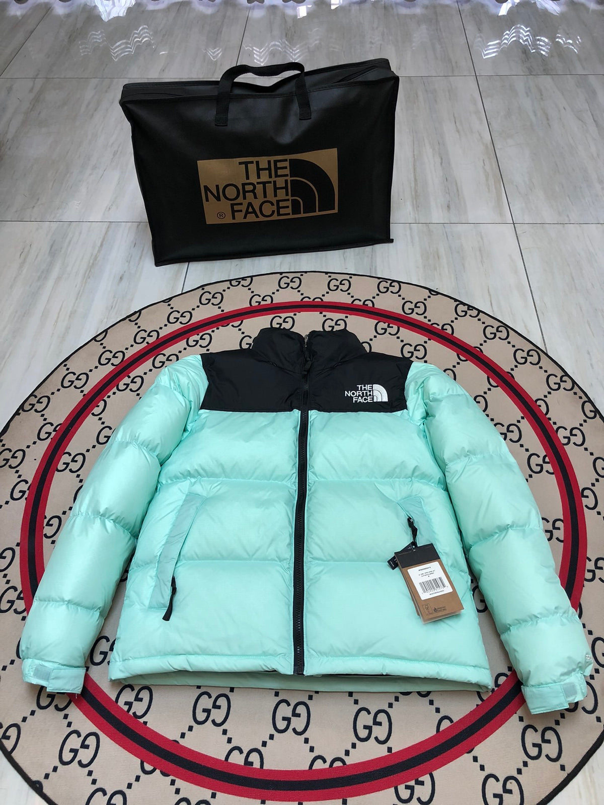 The North Face Mint Green and Black Colorblock Stand-Collar Puffer Jacket