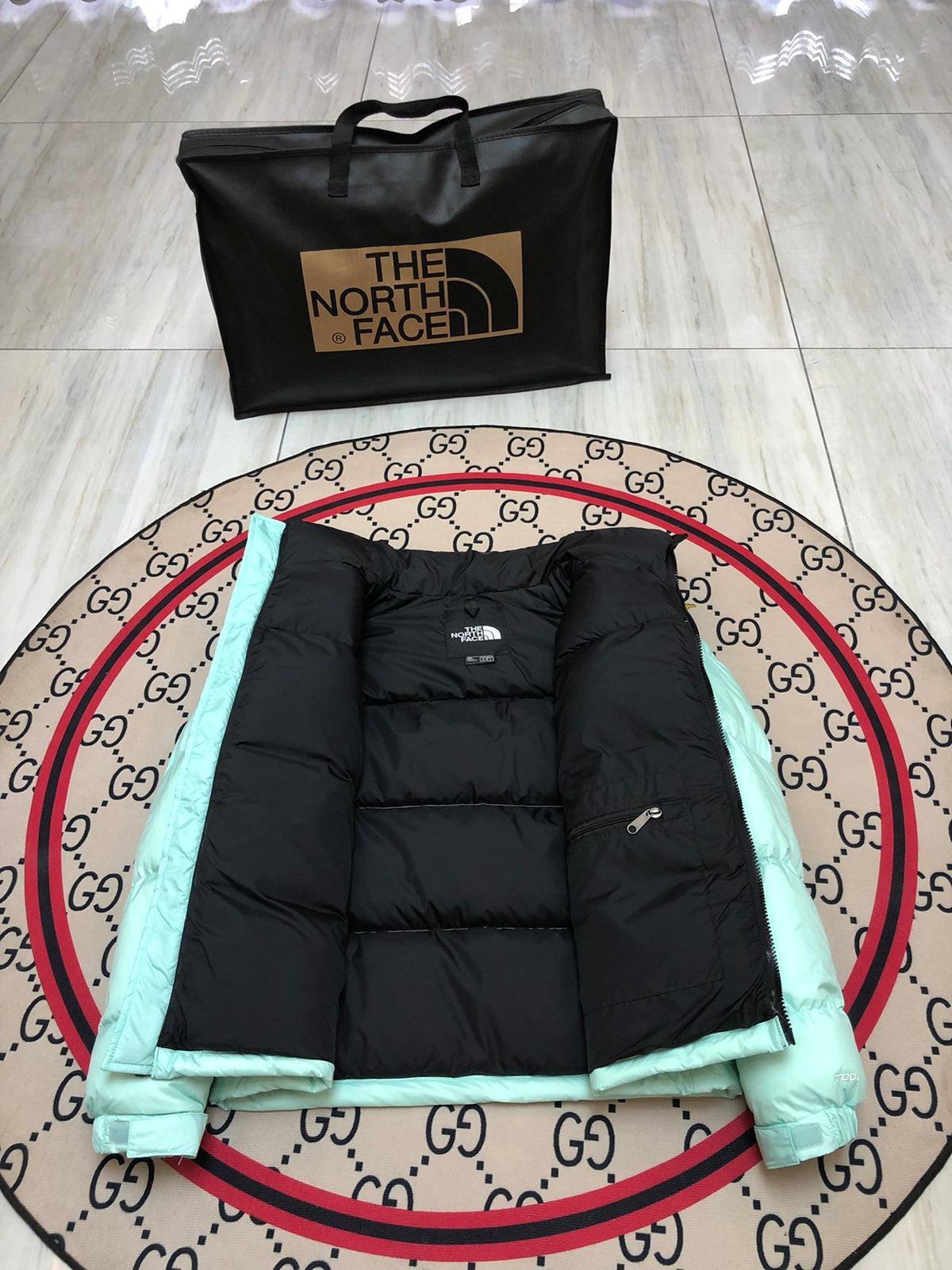 The North Face Mint Green and Black Colorblock Stand-Collar Puffer Jacket