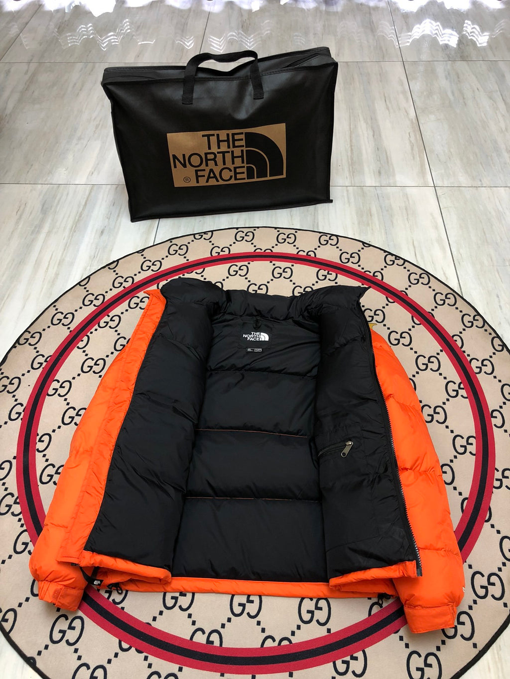 The North Face Orange and Black Colorblock Stand-Collar Puffer Jacket