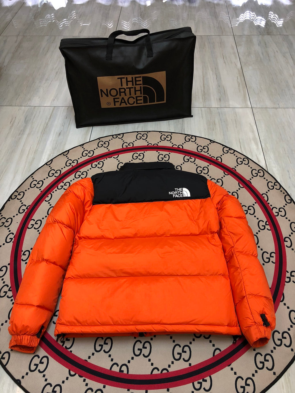 The North Face Orange and Black Colorblock Stand-Collar Puffer Jacket