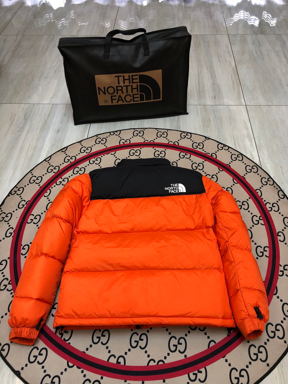 The North Face Orange and Black Colorblock Stand-Collar Puffer Jacket