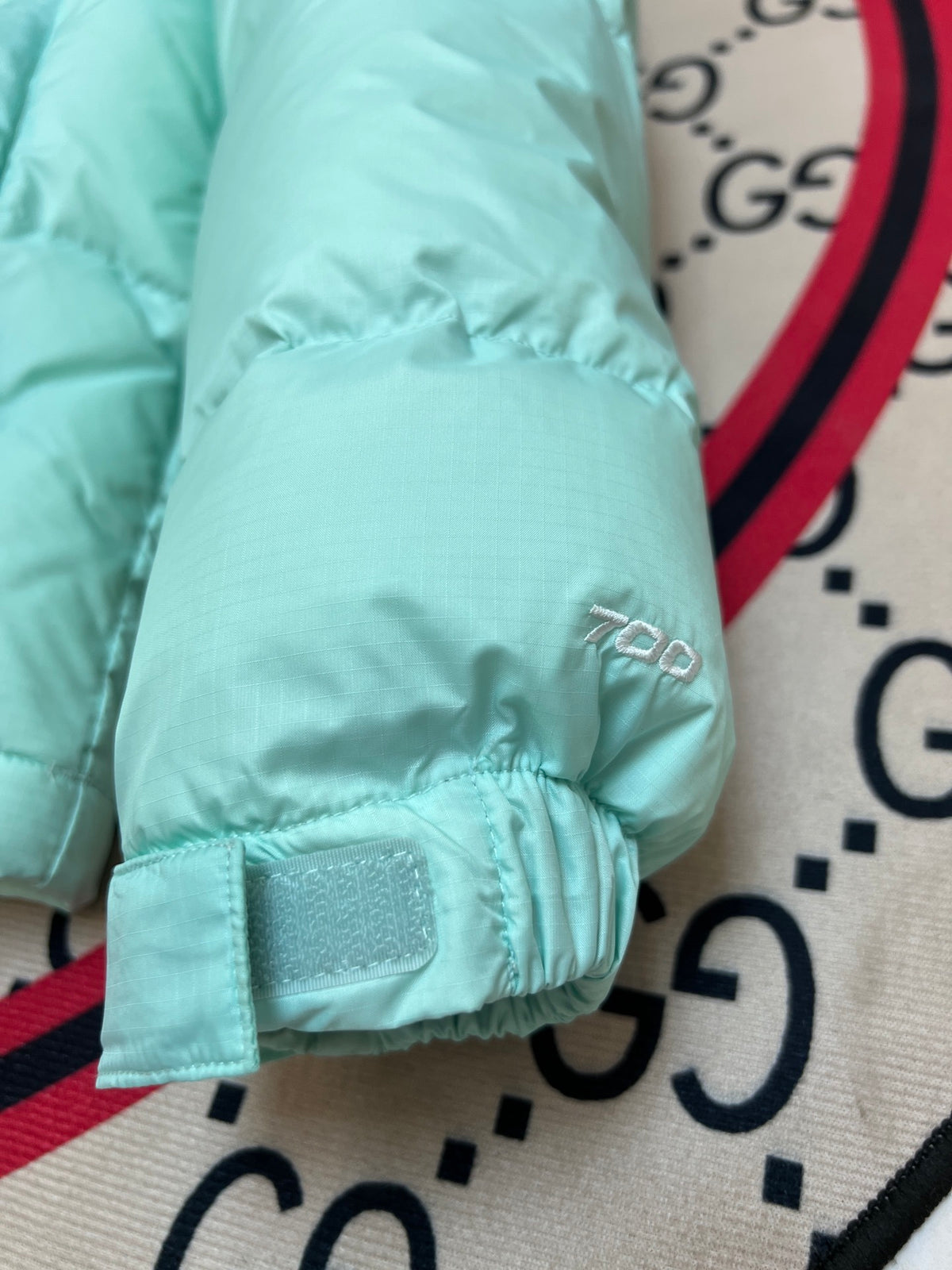 The North Face Mint Green and Black Colorblock Stand-Collar Puffer Jacket